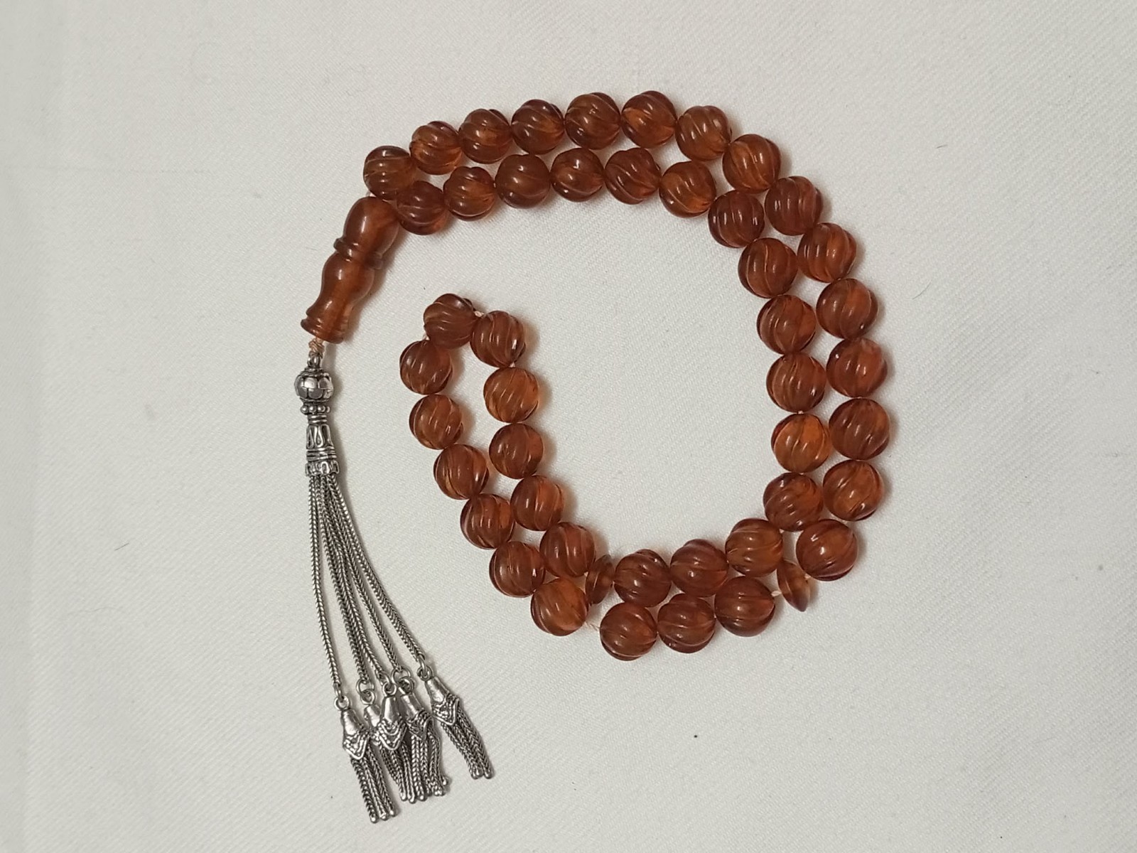 Natural amber rosary in transparent honey colour, old Melon cut