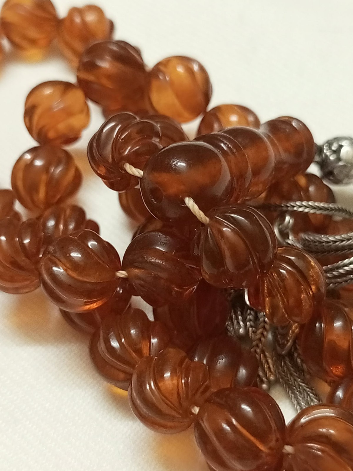Natural amber rosary in transparent honey colour, old Melon cut