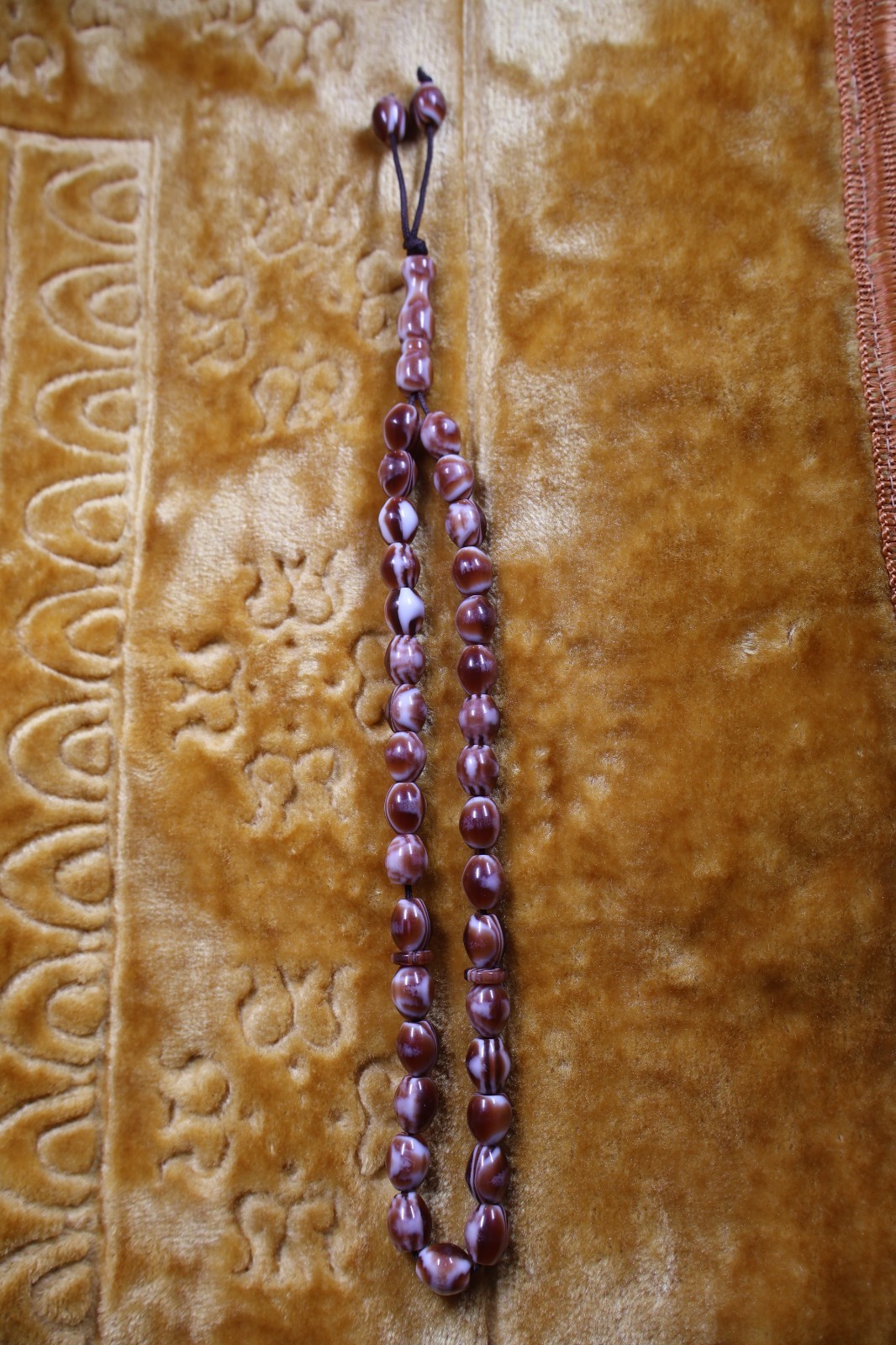 A collection of various antique prayer beads