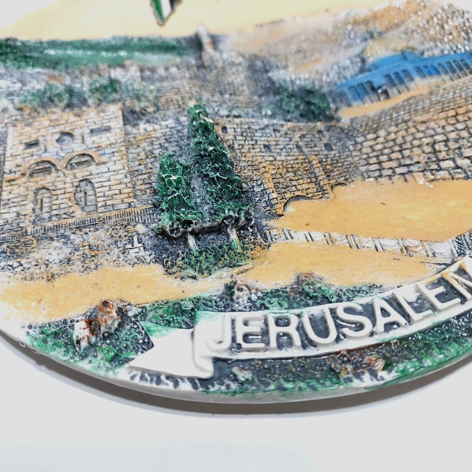 A ceramic masterpiece hanging on the wall, hand-engraved with Jerusalem
