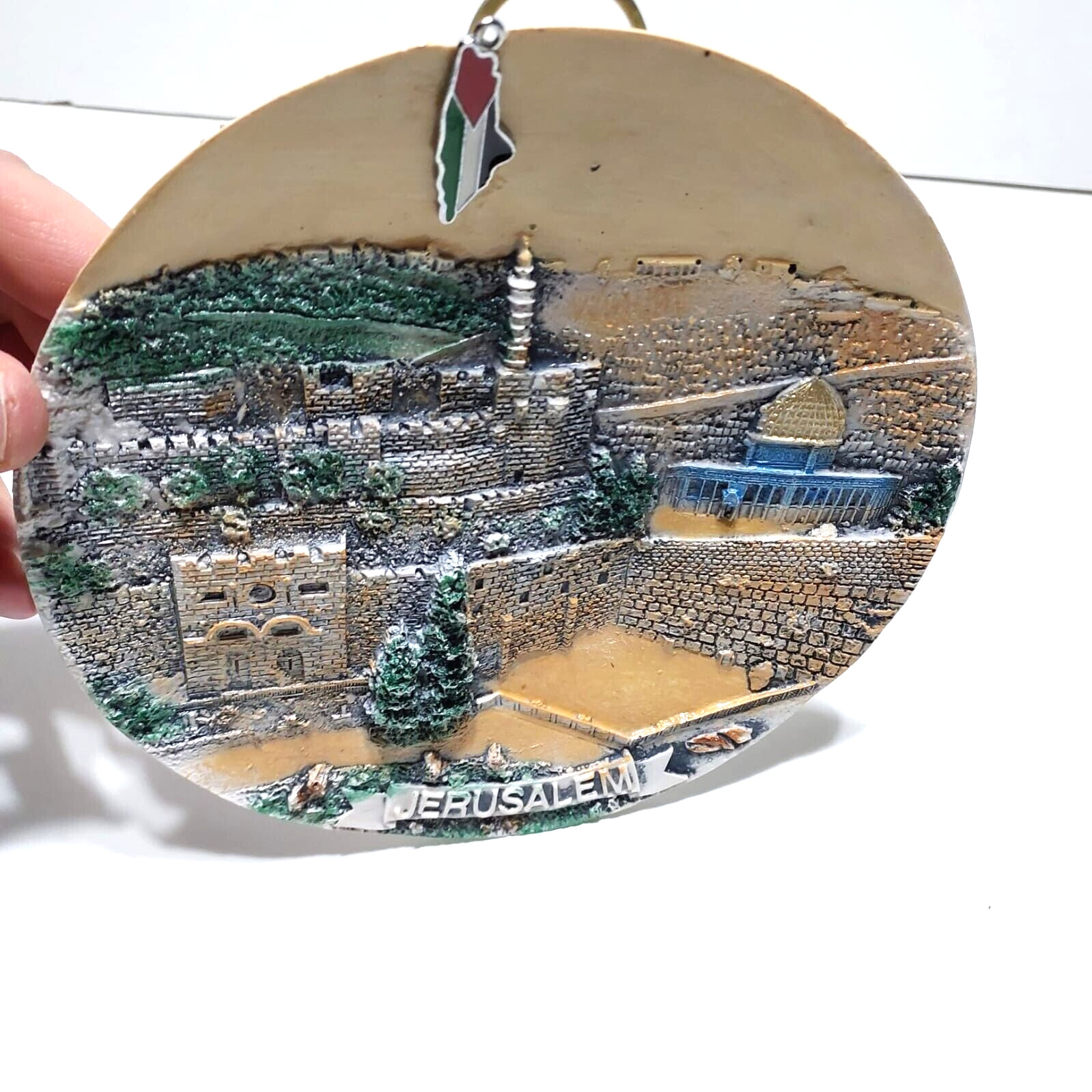A ceramic masterpiece hanging on the wall, hand-engraved with Jerusalem