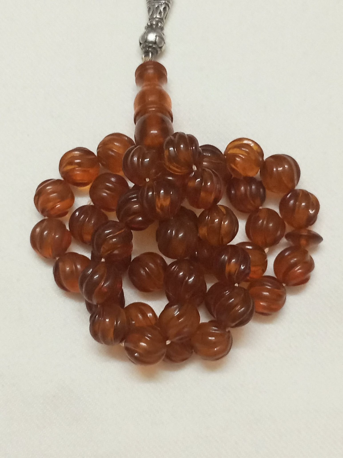 Natural amber rosary in transparent honey colour, old Melon cut