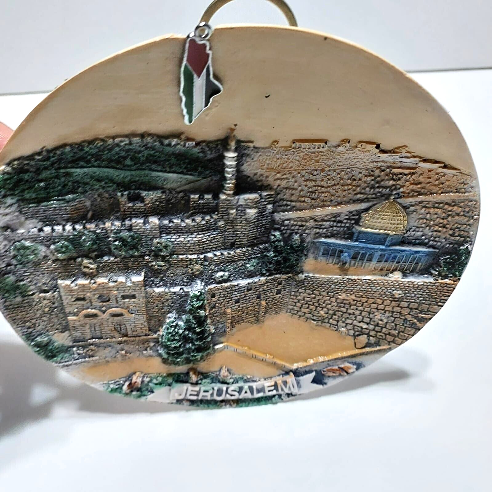 A ceramic masterpiece hanging on the wall, hand-engraved with Jerusalem
