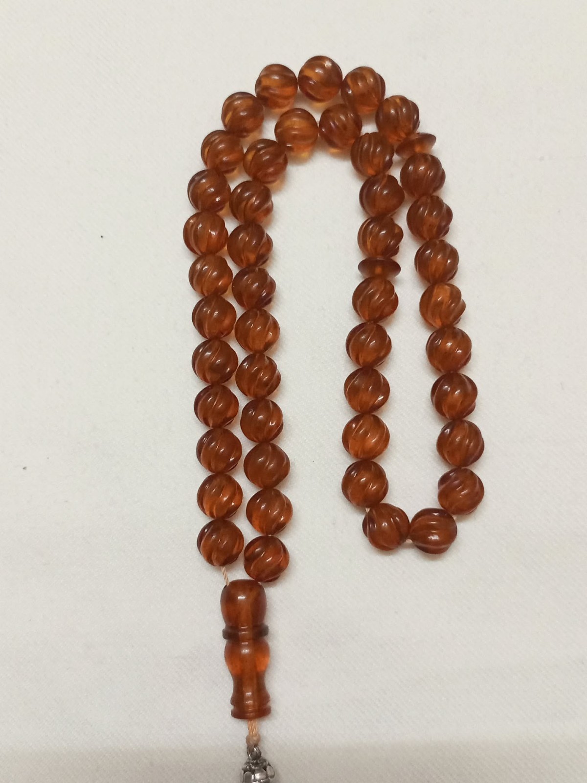 Natural amber rosary in transparent honey colour, old Melon cut